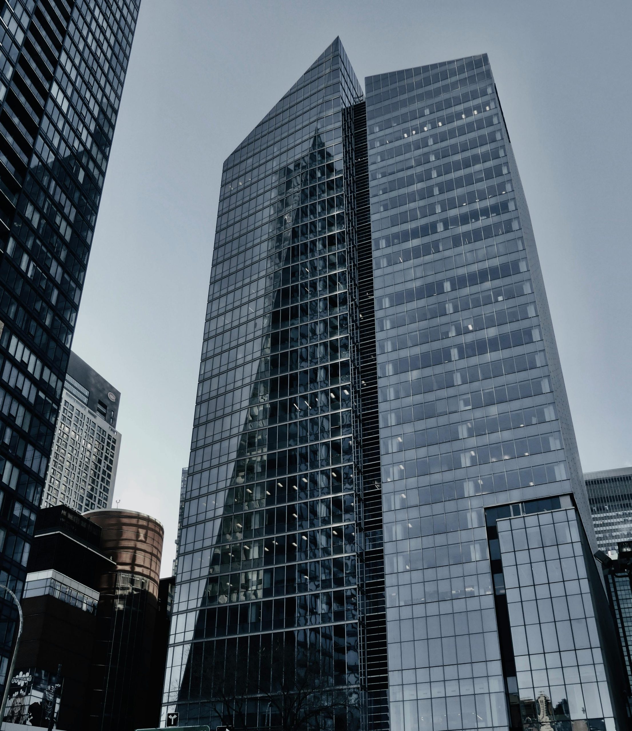 Skyscrapers with reflective glass panels in urban setting, shot at daytime.